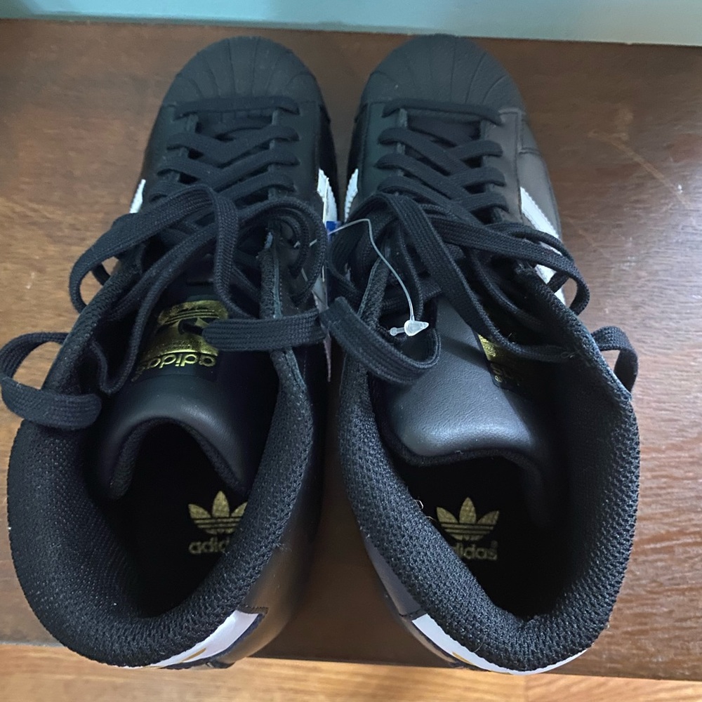 Adidas high top shell toe, Kids 6.5, woman’s 8, brand new in box.